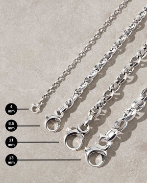 Close-up detail of the thorn-inspired polished sterling silver Stephen Webster bracelets, showcasing difference in sizes.