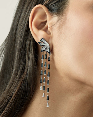 Model wearing Stephen Webster Cascade Enamel Earrings in 18ct white gold with diamonds, black spinels and enamel, glamorous luxury jewellery gift styling