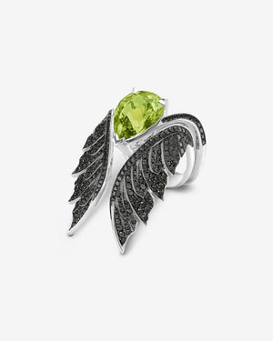 Angled view of peridot pear inner cocktail ring in 18ct white gold with diamond pavé detailing