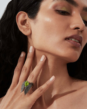 Pear Inner Cocktail Ring worn on hand showcasing peridot and diamond pavé design