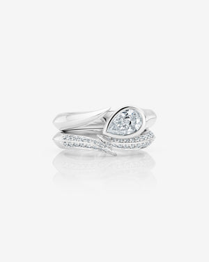 Women’s platinum Thorn Arc Solitaire Slimline ring with pear-cut white diamond with matching wedding band
