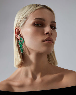 Plumage Long Earrings worn on ear, highlighting emerald and pavé sparkle