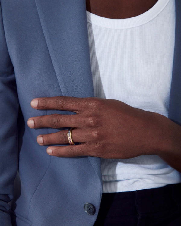 Quadrafoil rainbow baguette men’s wedding band worn on hand