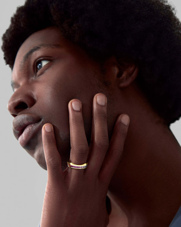 Quadrafoil rainbow baguette men’s wedding band worn on hand