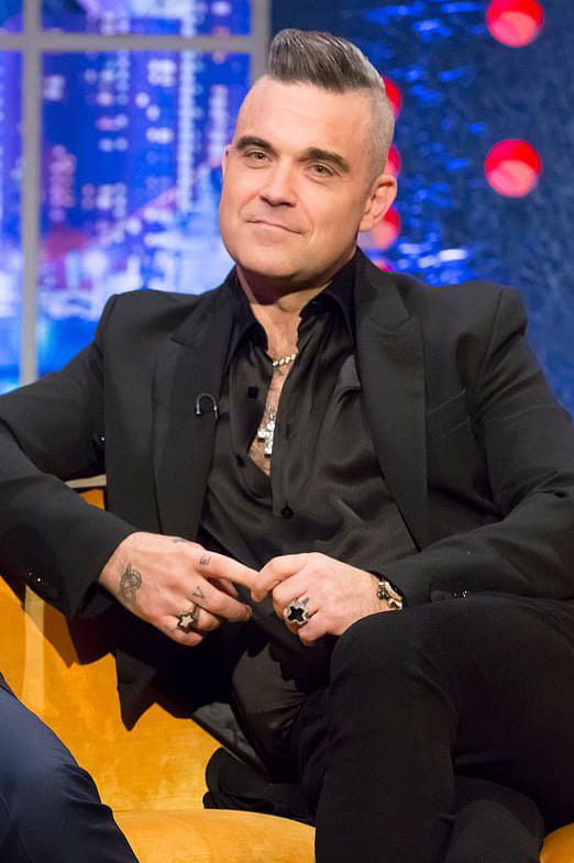 Robbie Williams wearing Stephen Webster Rockstar Ring and Sex & Drugs & Rock & Roll Ring