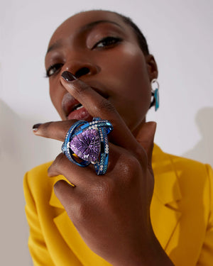 Model wearing Rocket Girl ReBelles ring — blue titanium and white-gold gemstone cocktail ring