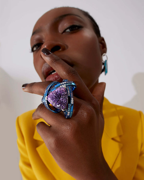 Model wearing Rocket Girl ReBelles ring — blue titanium and white-gold gemstone cocktail ring