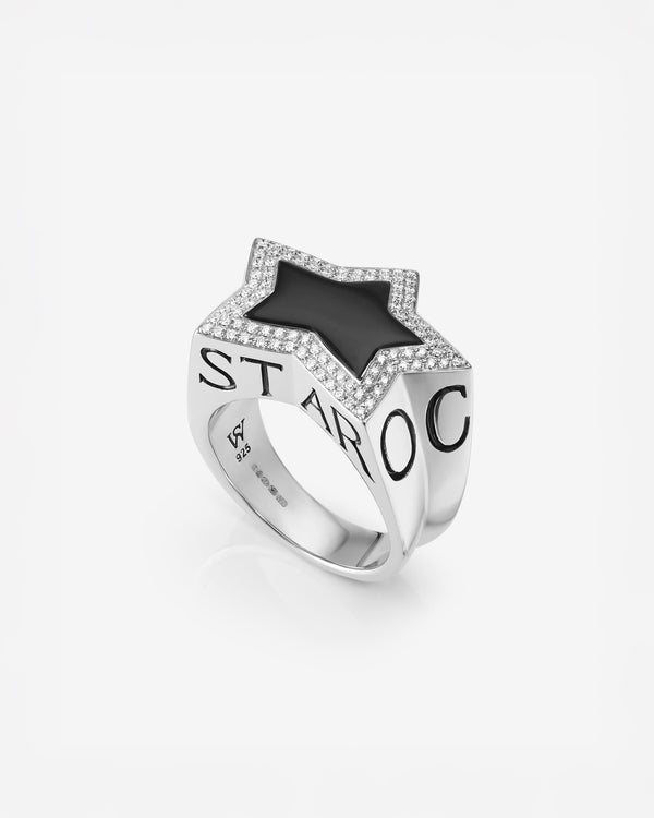 Stephen Webster Sex & Drugs & Rock & Roll cross-shaped ring in sterling silver with central black onyx star and pavé diamonds — front view