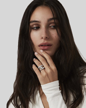 Stephen Webster Sculpted Solitaire Ring worn on hand in platinum with a round white diamond