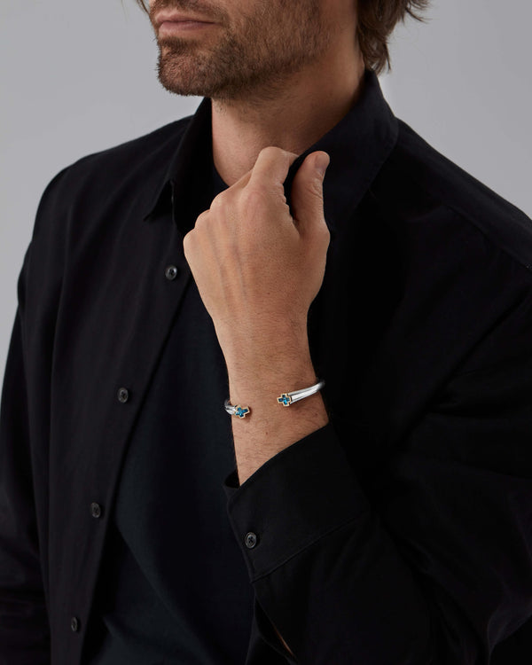 Model wearing Stephen Webster Sex & Drugs & Rock & Roll silver bangle with blue-topaz detail — men’s cuff bracelet