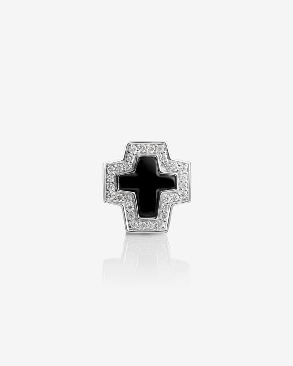 Flat-lay view of Stephen Webster cross-shaped black onyx earring on neutral background — Sex & Drugs & Rock & Roll collection