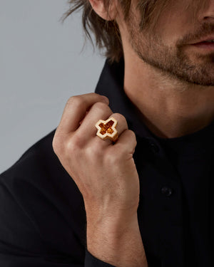 Model wearing Stephen Webster cross-shaped Sex & Drugs & Rock & Roll ring — yellow-gold ring with citrine cross