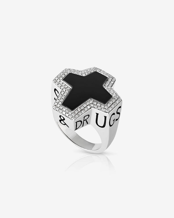 Stephen Webster Sex & Drugs & Rock & Roll cross-shaped ring in sterling silver with central black onyx cross and pavé diamonds — front view