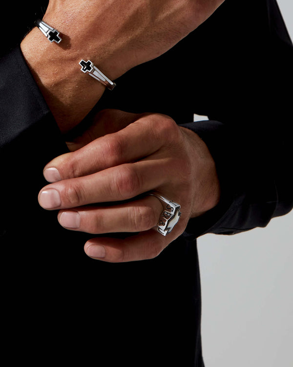 Side profile of Stephen Webster cross-shaped Sex & Drugs & Rock & Roll ring in silver with mother-of-pearl inlay