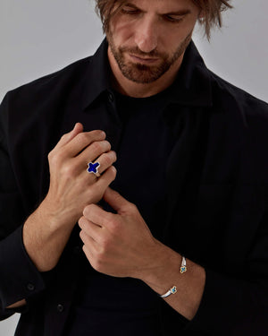 Model wearing Stephen Webster Sex & Drugs & Rock & Roll silver blue-enamel ring