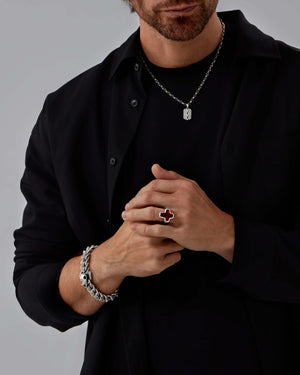 Model wearing Stephen Webster Sex & Drugs & Rock & Roll ring — silver ring with oxblood enamel inlay