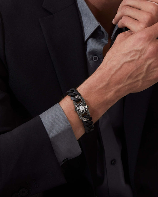 Model wearing Stephen Webster Shaken and Stirred clasp in 18k white gold with white & black diamonds and mother of pearl back plate