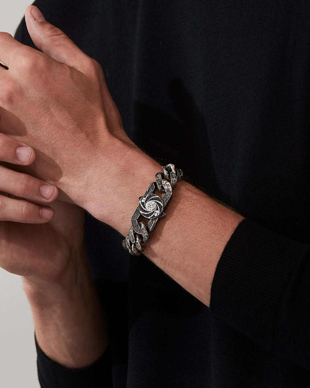 Stephen Webster Shaken and Stirred clasp in 18k white gold with white & black diamonds and mother of pearl back plate — front view