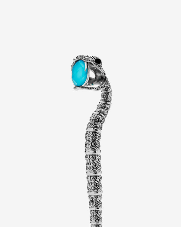 Close-up of quartz turquoise and snake skull handle on Silver Snake Measurer