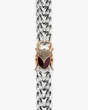 Close-up detail of red-enamel stag-beetle head with white-diamond pavé on Stephen Webster bracelet