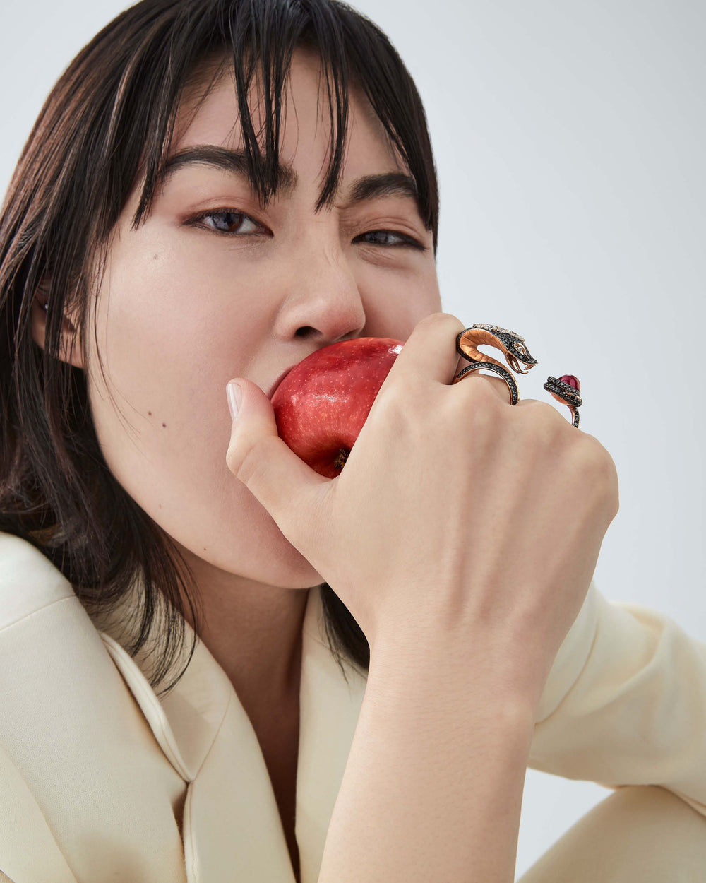 Stephen Webster All About Eve ring in 18ct rose gold featuring a sustainably sourced ruby and pavé-set black and white diamonds, luxury British fine jewellery design