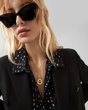 Stephen Webster Black Enamel personalised pendant on gold chain — 18 ct gold vinyl pendant displayed hanging on chain, enamel vinyl detail visible