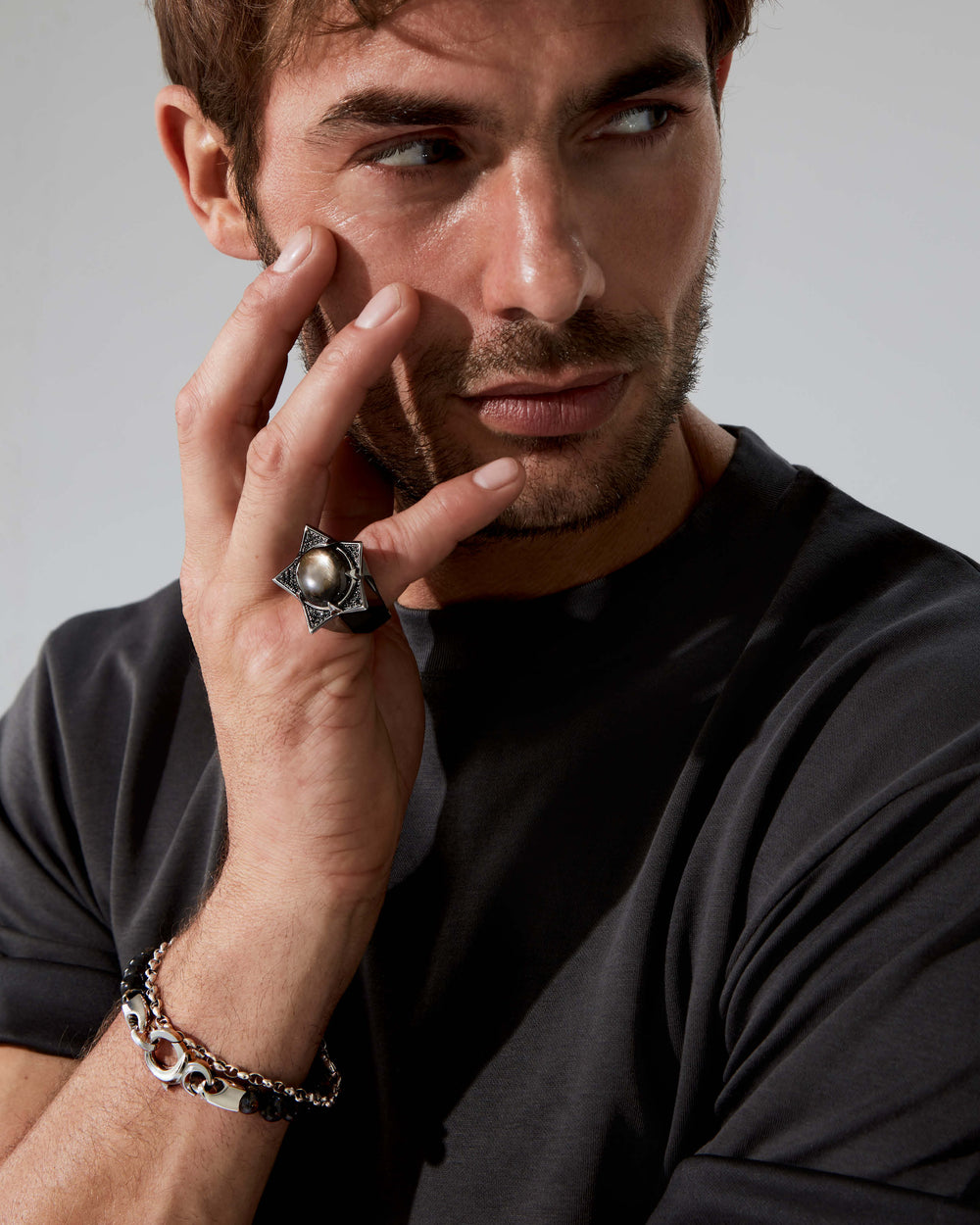 Side profile of Black Sapphire Star ring — sterling silver band 10 mm wide, showing stone setting, band thickness and polished finish