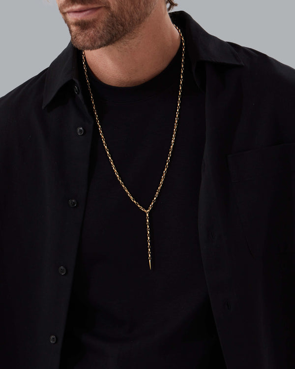 Model wearing Classic Thorn Lariat 18 k yellow gold necklace by Stephen Webster