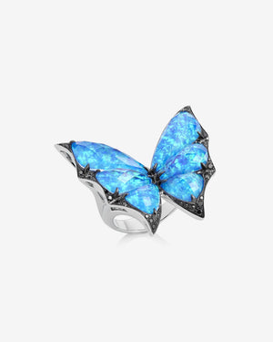 Side profile of Stephen Webster Crystal Haze butterfly ring — 18 ct white gold and blue faceted quartz