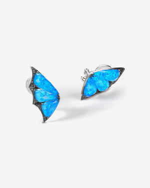 Side profile of Stephen Webster Crystal Haze blue butterfly cuff earrings showcasing Black Opalescent quartz and black diamond pavé