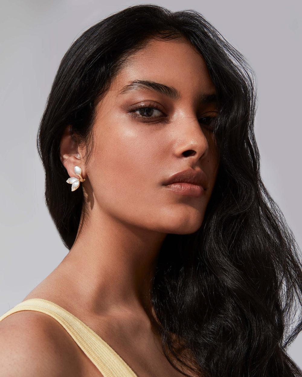 Stephen Webster Crystal Haze Chance white mother of pearl chance earrings in 18ct yellow gold with opalescent Crystal Haze and white diamond pavé, premium studio front view