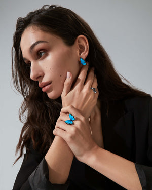 Stephen Webster Crystal Haze butterfly cocktail ring on a model’s hand — 18 ct white gold statement ring