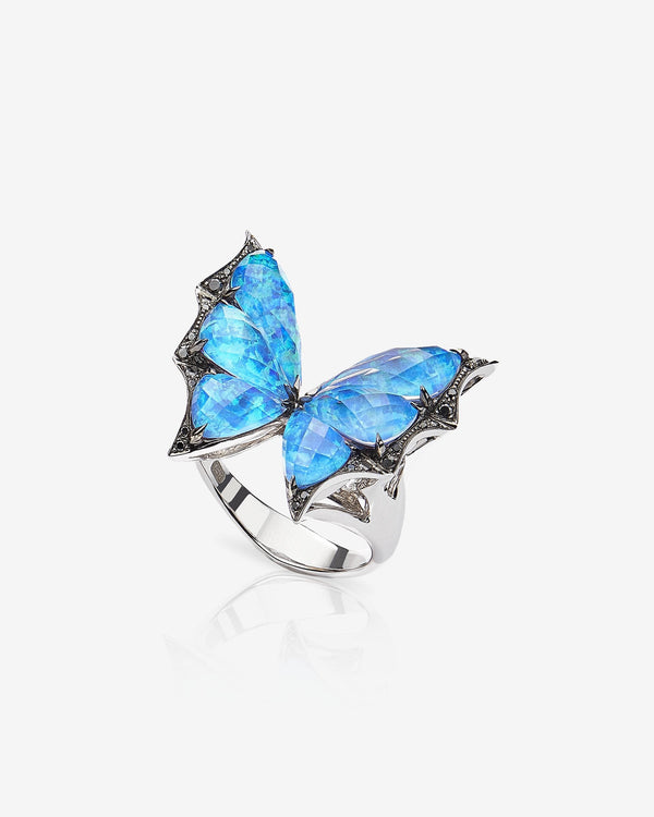 Side profile of Stephen Webster Crystal Haze butterfly cocktail ring — 18 ct white gold and faceted blue Crystal Haze quartz