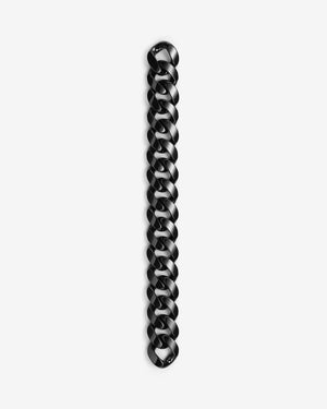 Stephen Webster black ceramic Cuban bracelet — full length laid flat, polished black ceramic links visible