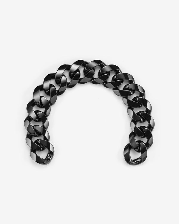 Stephen Webster black ceramic Cuban bracelet — full length laid flat, polished black ceramic links visible