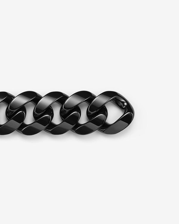 Stephen Webster black ceramic Cuban bracelet — full length laid flat, polished black ceramic links visible