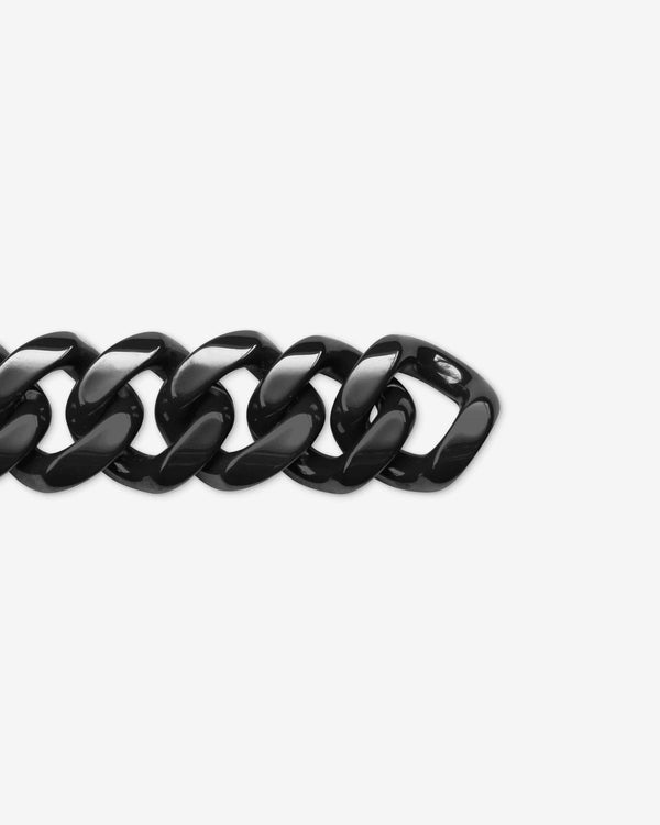 Stephen Webster black ceramic Cuban bracelet — full length laid flat, polished black ceramic links visible