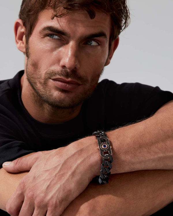 Model wearing Stephen Webster Cuban black-ceramic bracelet — bracelet visible on wrist, showing fit and polished black ceramic finish