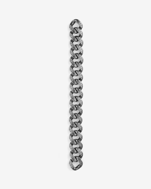 Stephen Webster Cuban bracelet in silver laid flat — full length showing engraved smoke-pattern links