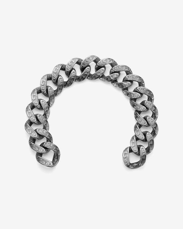 Stephen Webster Cuban bracelet in silver laid flat — full length showing engraved smoke-pattern links