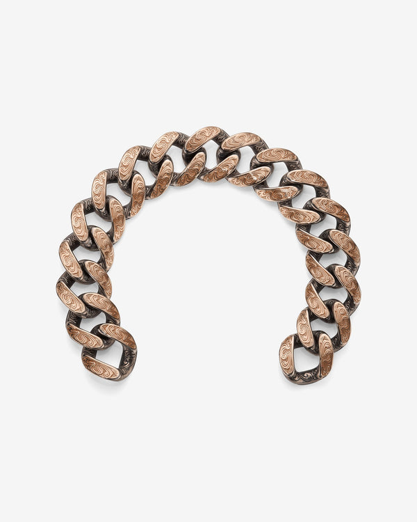 Stephen Webster Cuban bracelet in silver & rose gold laid flat — full length showing engraved smoke-pattern links