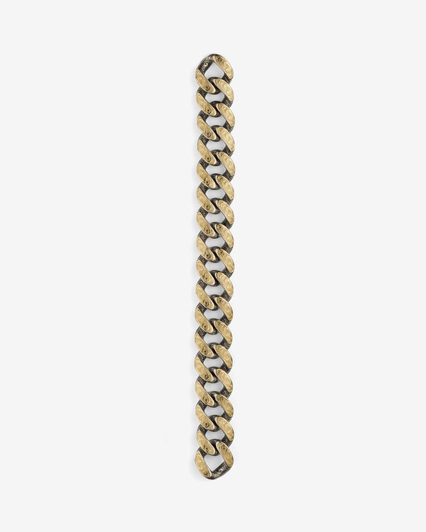 Stephen Webster Cuban bracelet in silver & yellow gold laid flat — full length showing engraved smoke-pattern links