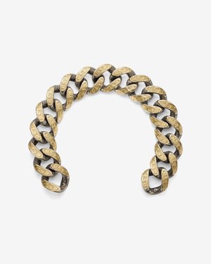 Stephen Webster Cuban bracelet in silver & yellow gold laid flat — full length showing engraved smoke-pattern links