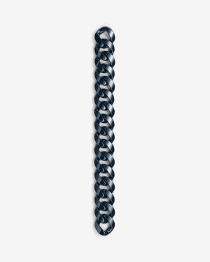 Close-up of Stephen Webster Cuban polished navy blue ceramic bracelet — detailed view of polished ceramic link surface and link joints