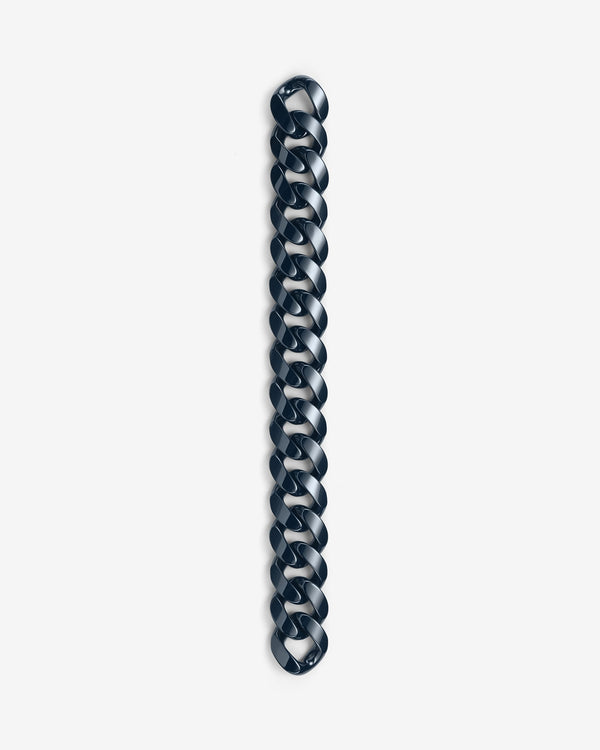 Close-up of Stephen Webster Cuban polished navy blue ceramic bracelet — detailed view of polished ceramic link surface and link joints