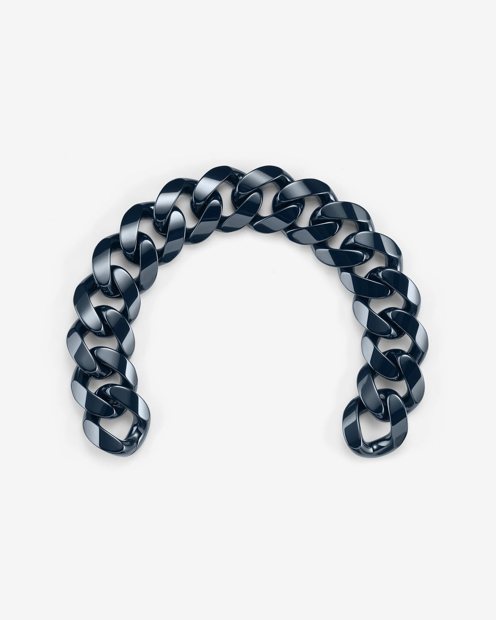 Close-up of Stephen Webster Cuban polished navy blue ceramic bracelet — detailed view of polished ceramic link surface and link joints