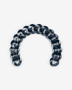 Close-up of Stephen Webster Cuban polished navy blue ceramic bracelet — detailed view of polished ceramic link surface and link joints
