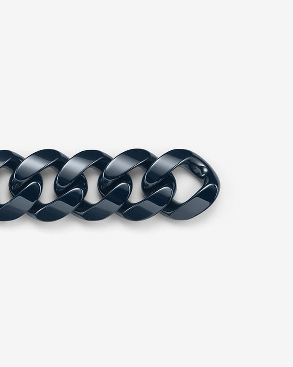 Close-up of Stephen Webster Cuban polished navy blue ceramic bracelet — detailed view of polished ceramic link surface and link joints