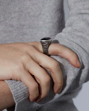 Angled view of the Embankment Fish ring by Stephen Webster — highlighting the Hematite Crystal Haze gemstone, ring depth and polished metal finish