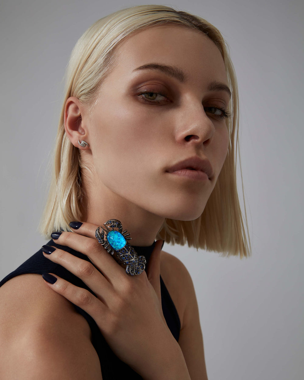 Stephen Webster Jewels Verne Lobster Crystal Haze Long Finger Ring in 18ct white gold with Black Opalescent Crystal Haze, blue sapphire pavé and black diamond pavé, luxury fine jewellery statement